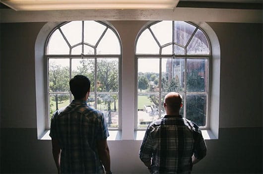 counseling Men looking out a window